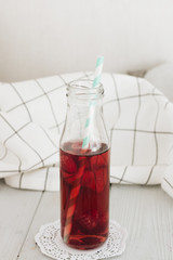 Delicious homemade raspberry lemonade with drinking straw