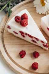 Two pieces of delicious cake with raspberries, sweet dessert