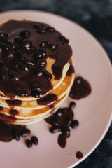 Stack of delicious homemade pancakes with sauce