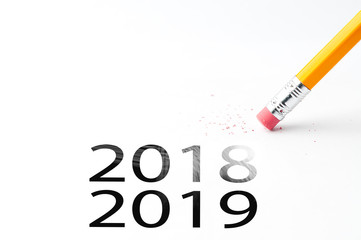 Closeup of pencil eraser and black 2018, 2019 text. Christmas background for office. Pencil with eraser.