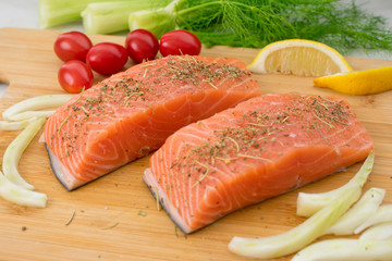 Salmon and Vegetables on a Cutting Board