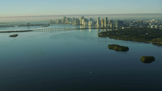 Aerial sunrise view of Julia Tuttle Causeway bridge Metropolitan Downtown Miami Skyline Biscayne Bay Florida USA 