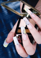 a woman's nail, designed with nail art