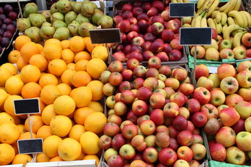 Lots of fresh organic red apples and juicy oranges on the market  pattern background