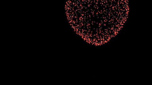 Heart shaped firework animation on dark background