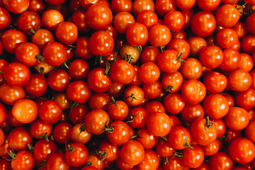 Pile of fresh ripe tomatoes, food background