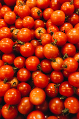 Pile of fresh ripe tomatoes, food background