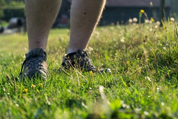 Man in sport shoes in the grass. Czech Republic