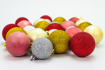 A lot of colorful Christmas baubles isolated on a white background with a clipping path, christmas decorations.