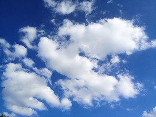 Blue sky with fluffy clouds copy space