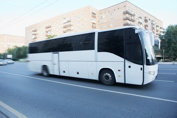 tourist bus goes on the city street © Yuri Bizgaimer