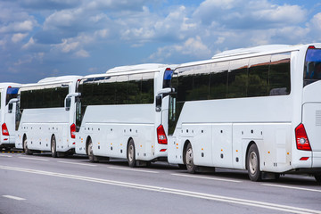 buses on a city street in summer