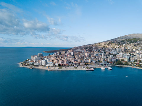 Professional photo taken in Saranda Albania Balkan Europe  showing the port and a part of the city from an aerial view. ionian sea , Mediterranean sea , blue sky blue sea 