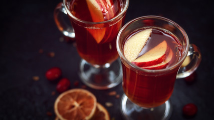 Mulled cider with spices and apple, orange fruit