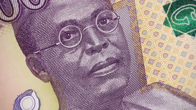 Nigeria 100 naira (2014) banknote rotating, Nigerian money close up.  4K UHD video footage