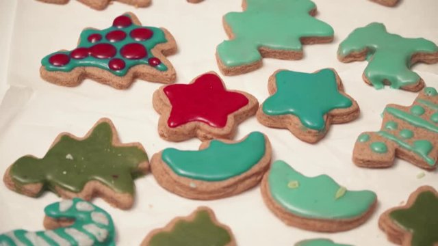 View of homebaked gingerbreads iced with colorful glaze. Christmas baking.