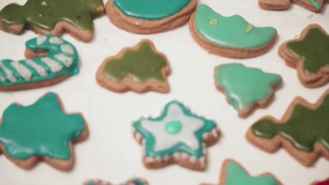 View of homebaked gingerbreads iced with colorful glaze. Christmas baking.
