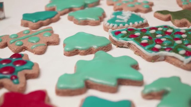 View of homebaked gingerbreads iced with colorful glaze. Christmas baking.