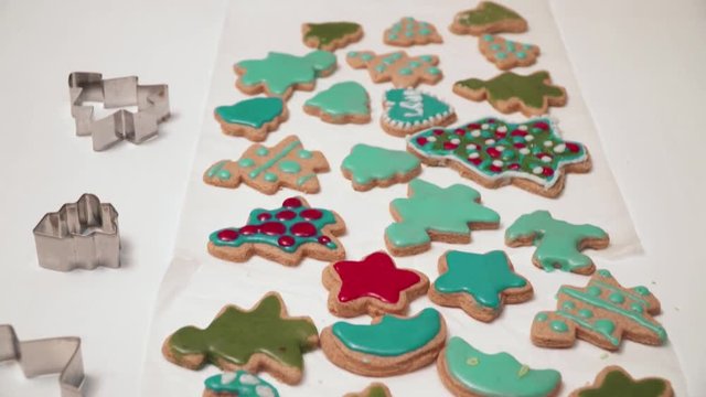 View of homebaked gingerbreads iced with colorful glaze. Christmas baking.