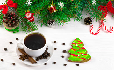 Obraz na płótnie Canvas Christmas tree on a white background and a cup of coffee