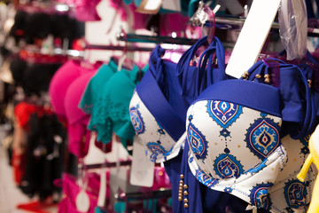 Fototapeta premium Women swimsuits in the retail store. Fashion shopping concept