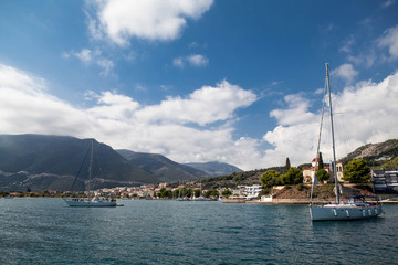 Fototapeta na wymiar Summer seascape in Greece& Blue sky, lots of yachts and sgreek seaside