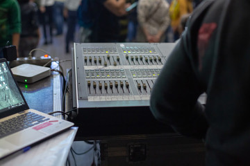 Soundman working on the mixing console.