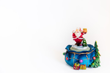 Cute toy Santa Claus isolated on white background