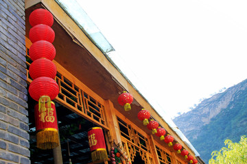 Wooden eaves and red lanterns in the CuanDiXia village, Beijing, China