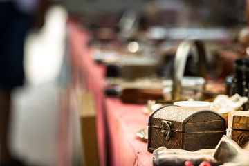 A small retro jewelry wooden box on a large table in a street vintage market in Croacia.