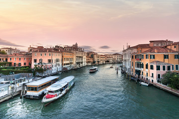 View of the Grand Canal with Vaporetto stop Venice at evening, Italy. - obrazy, fototapety, plakaty