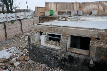 Demolition remains of an apartment building on a closed construction site