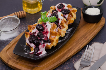 Belgium waffles. Waffle breakfast with yogurt and fruit sauce