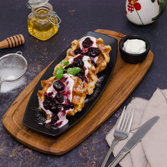 Belgium waffles. Waffle breakfast with yogurt and fruit sauce