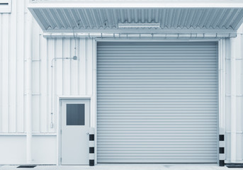 Naklejka na ściany i meble Roller door or roller shutter. Also called security door or security shutter with automatic system. For protection residential and commercial building i.e. house, warehouse, factory, shop and store.