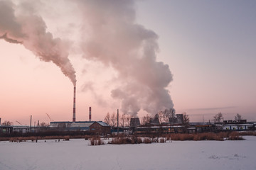 Smoke and fog from thermal power plant at winter