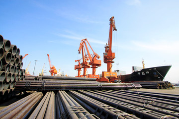 portal crane and pipes on the shipping dock