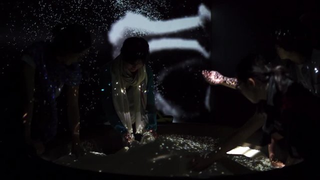 japanese girls having fun playing around at a japanese light exhibition or event, happy moment, magical moment