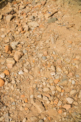 Old beige stone wall background texture close up