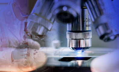 Close-up shot of microscope with metal lens at laboratory