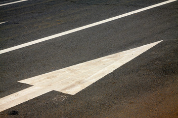 White markings on the asphalt road