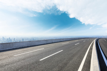 Panoramic city skyline and buildings with empty asphalt road