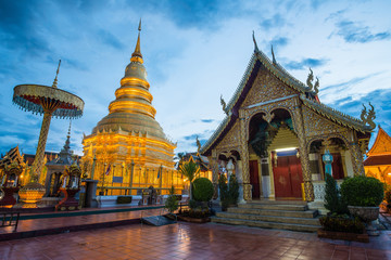 Fototapeta na wymiar Wat Phra That Hariphunchai the iconic famous temple in Lamphun city, Northern Thailand. View after sunset.