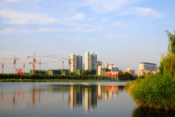 Urban construction sites by a park