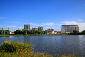 Fototapeta na wymiar city scenery, buildings stand beside the river
