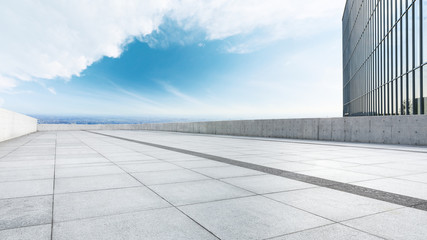 Panoramic city skyline and buildings with empty square floor