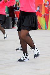 red jacket and sports shoes