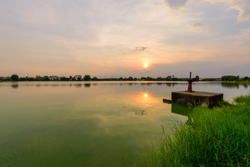 water gate at canal in sunset time