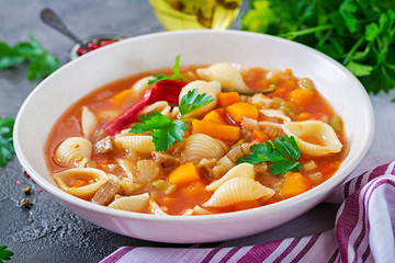 Minestrone, italian vegetable soup with pasta on  table. Vegan food