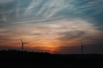 Fototapeta na wymiar Sunset above windmills